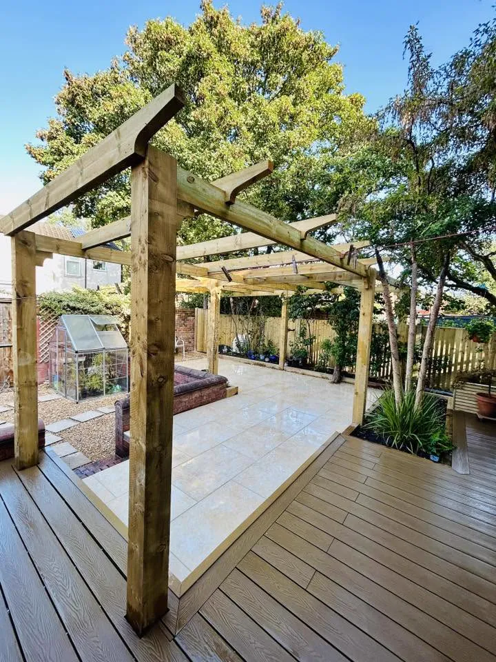 New timber pergola spanning porcelain patio and composite decking